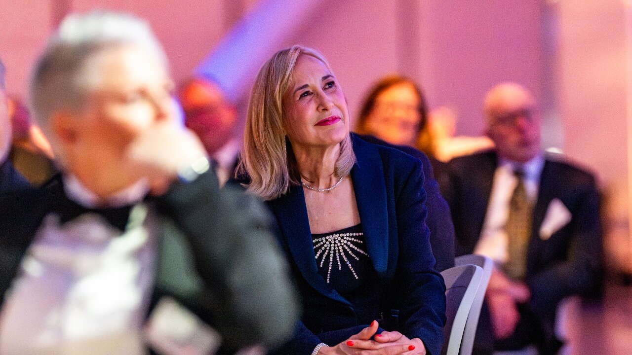 President Marie Hardin looking up at the stage during the Quinnipiac Gala