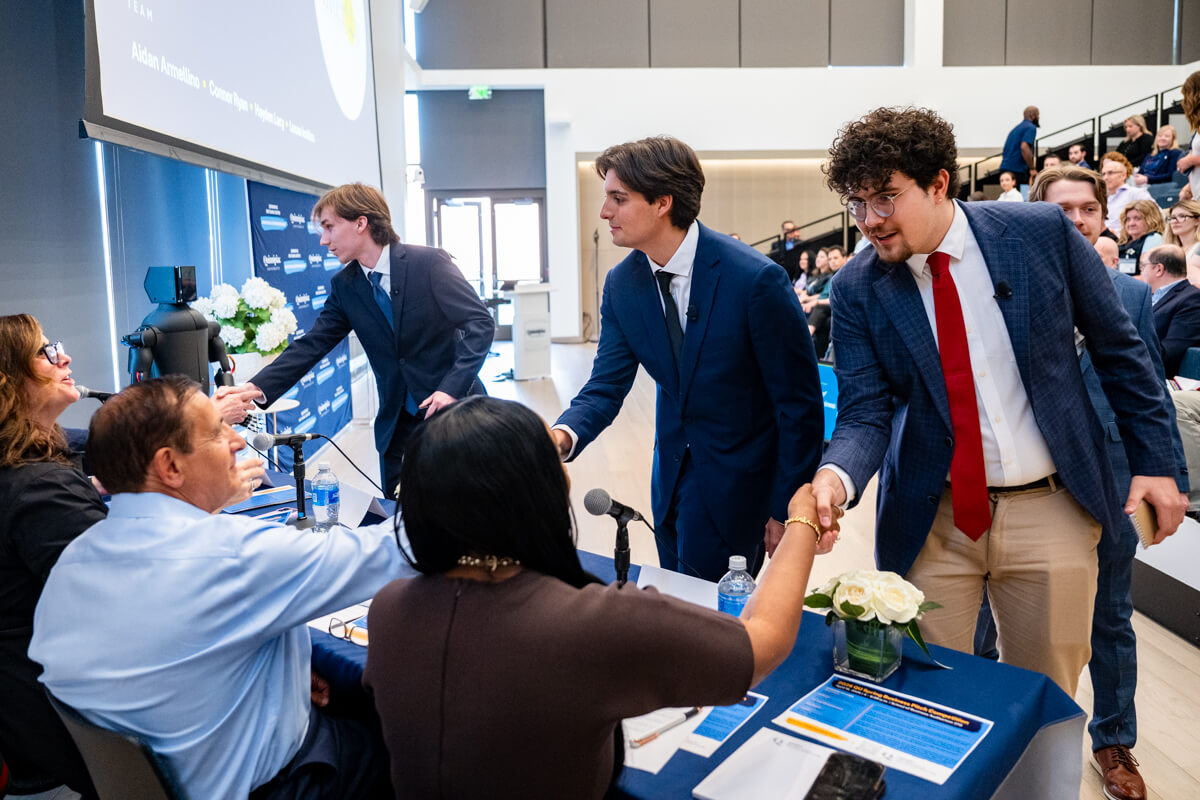 Students shake judges hands