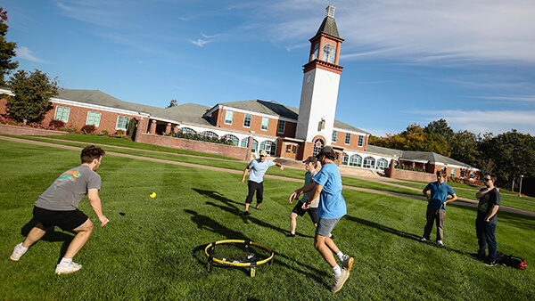 Students playing Spikeball on the Quad