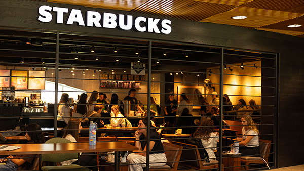 A wide shot view of students sitting in Starbucks