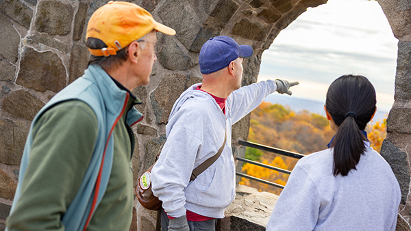 Student and family members enjoying the view from the castle on the Sleeping Giant