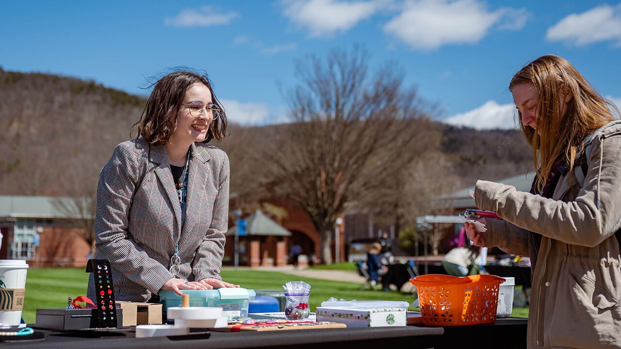 A student looks at merchandise.