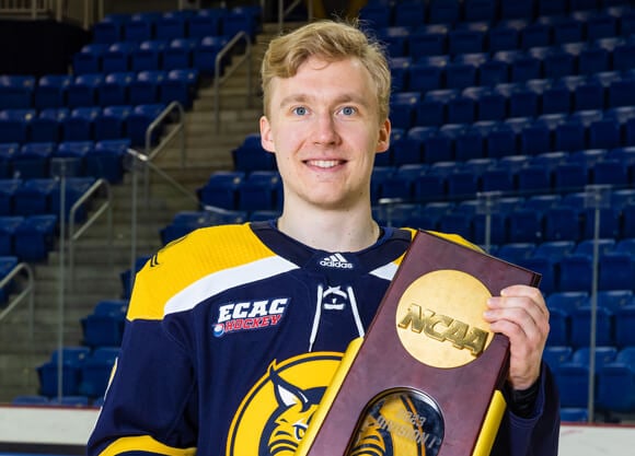 iivari rasanen holds national championship trophy for photo