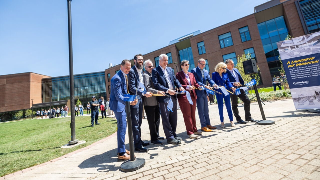 Group cut a ribbon