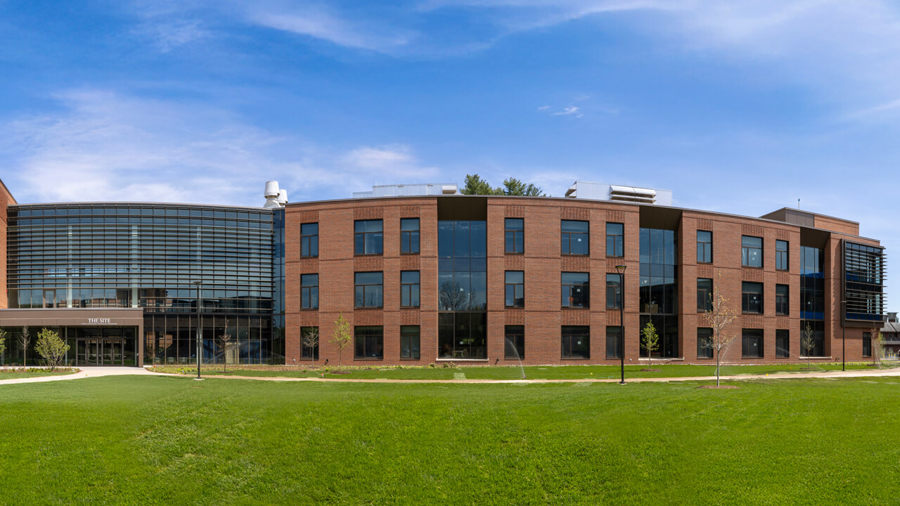 Exterior of The SITE building on a bright, sunny and cloudless day