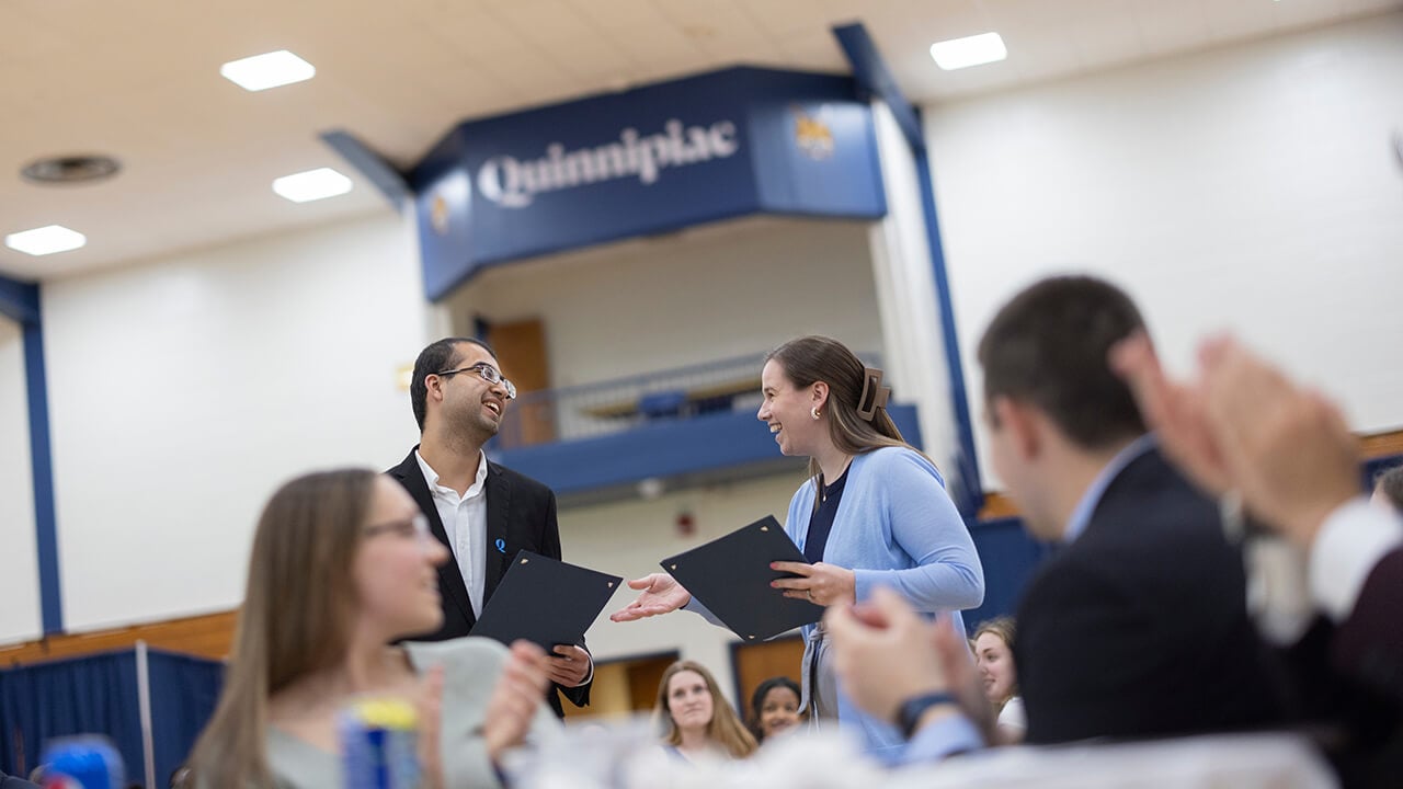 A student is awarded a certificate.