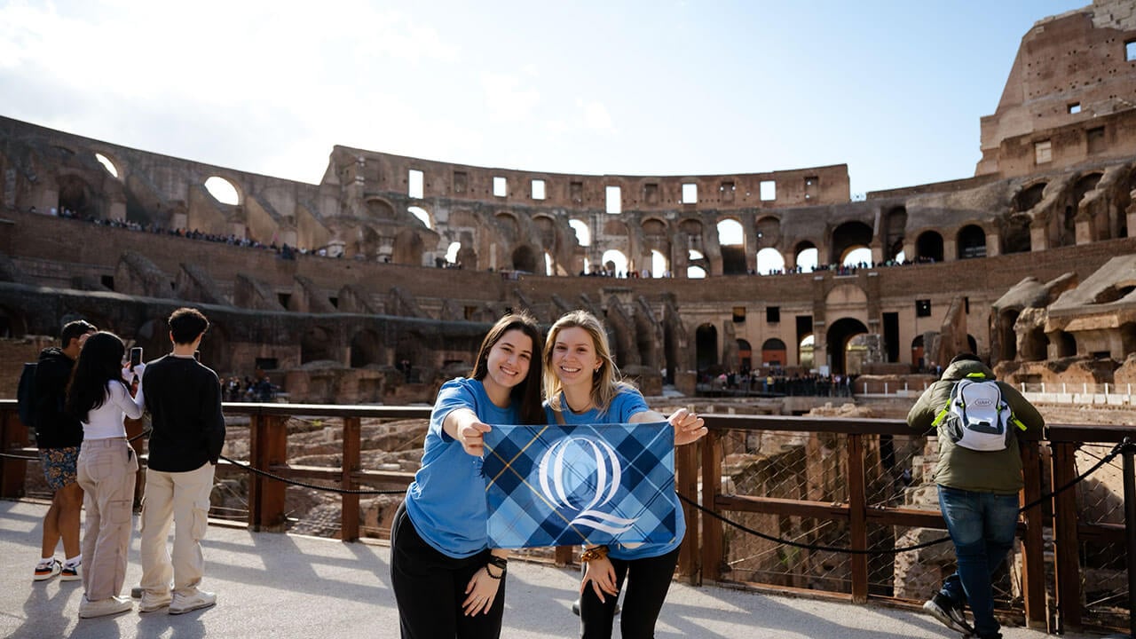 Student pose in front of the Colosseum in Rome, Italy