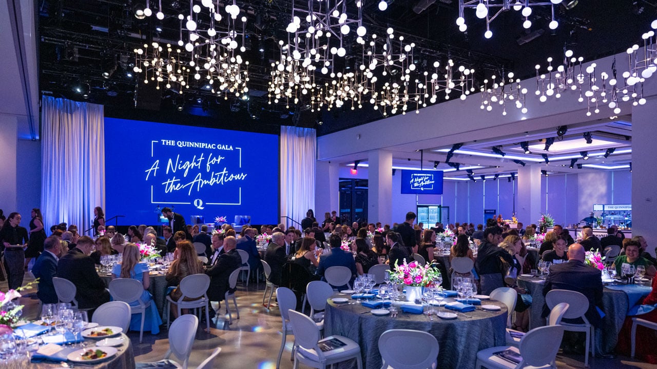 People sitting at tables at the gala