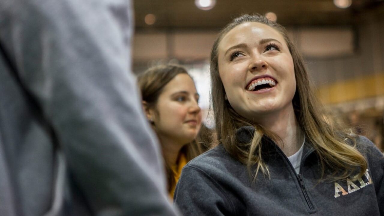 Kozyra smiles as she watches a speech during The Big Event.