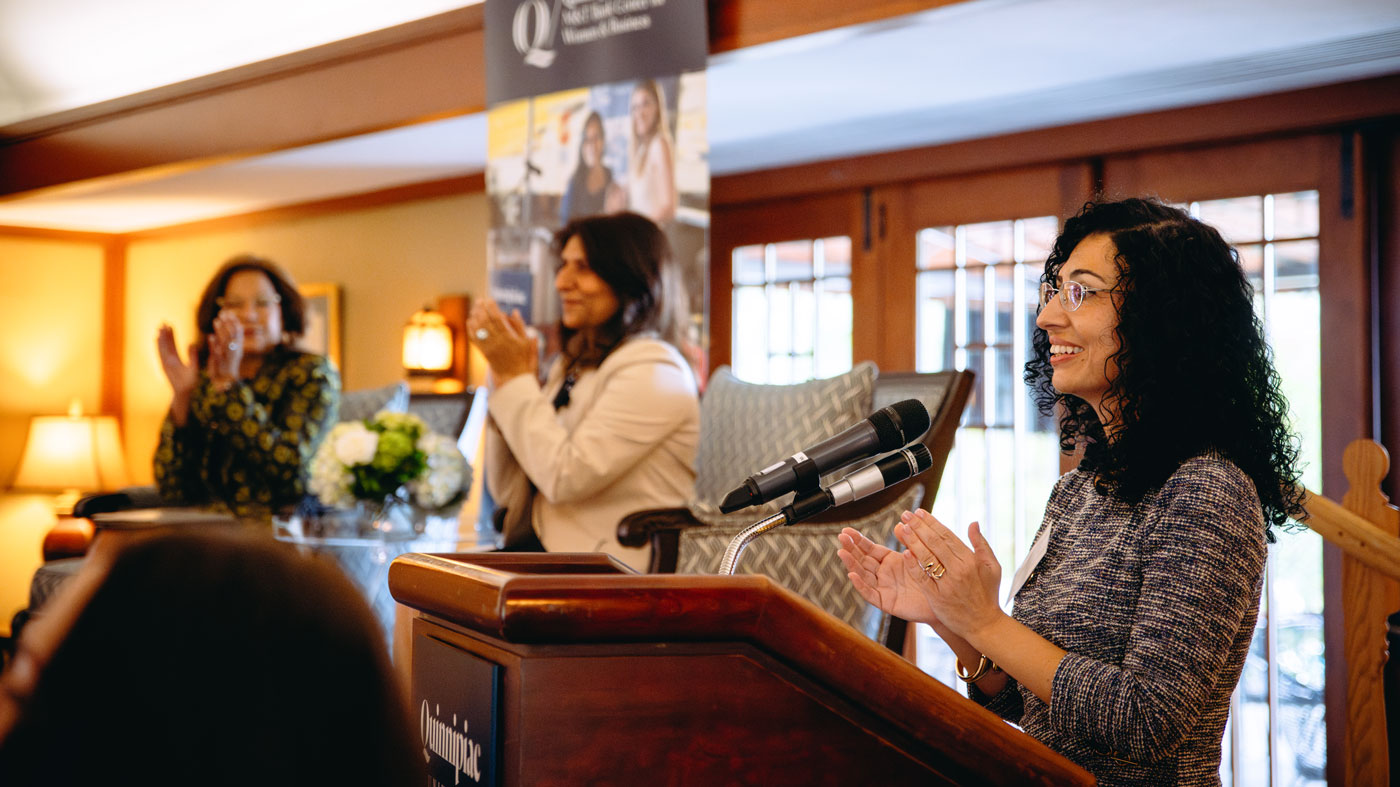 School of Business faculty members speak at the event.