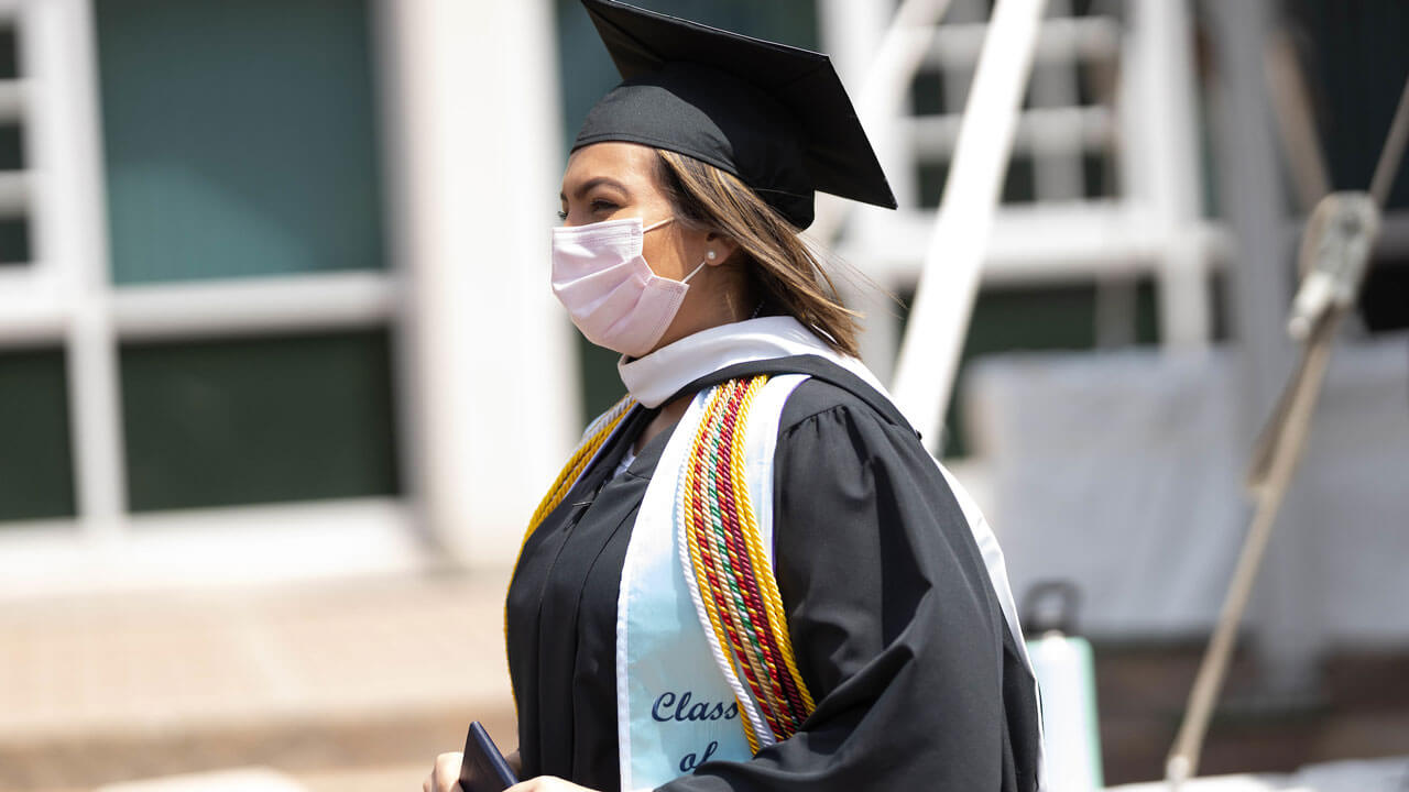 Student wearing multiple ropes