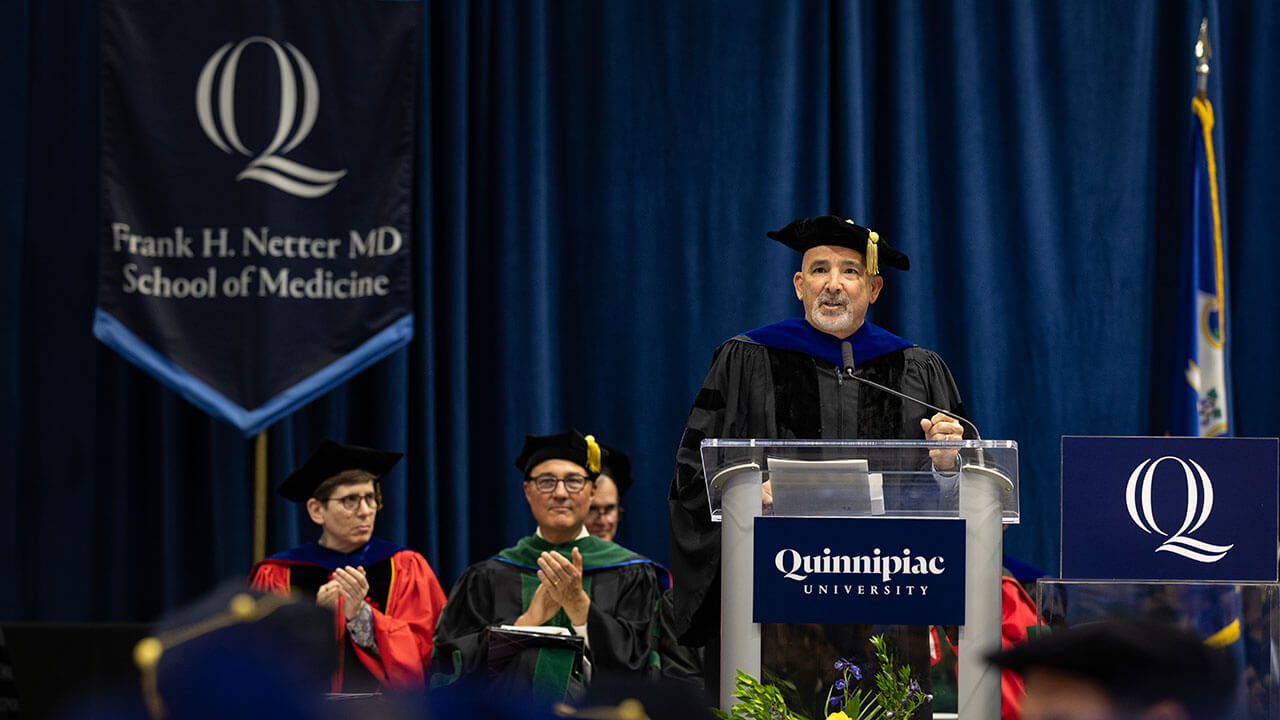 Paul Calamita, MBA '92, welcomes the new graduates into the alumni association