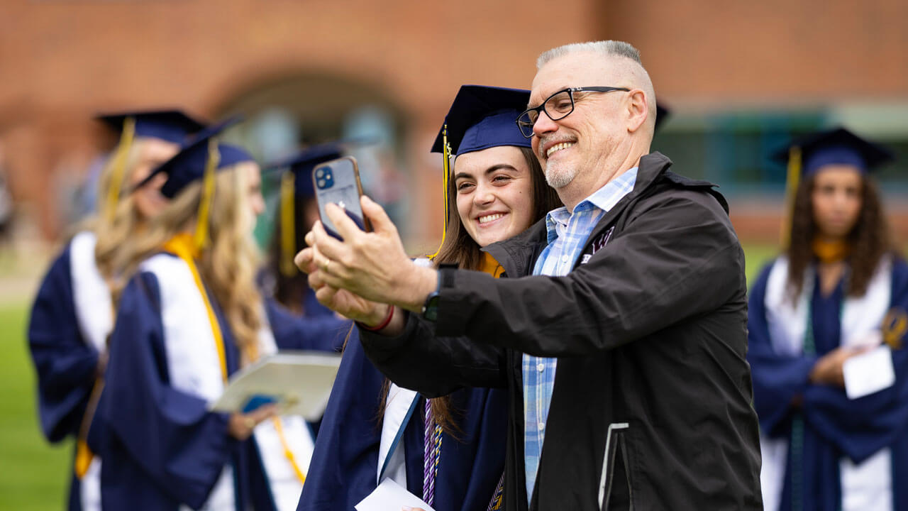 Graduate takes selfie with loved one