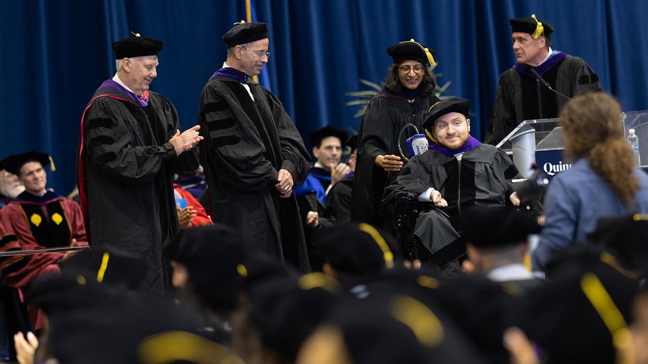 Graduate crosses the stage