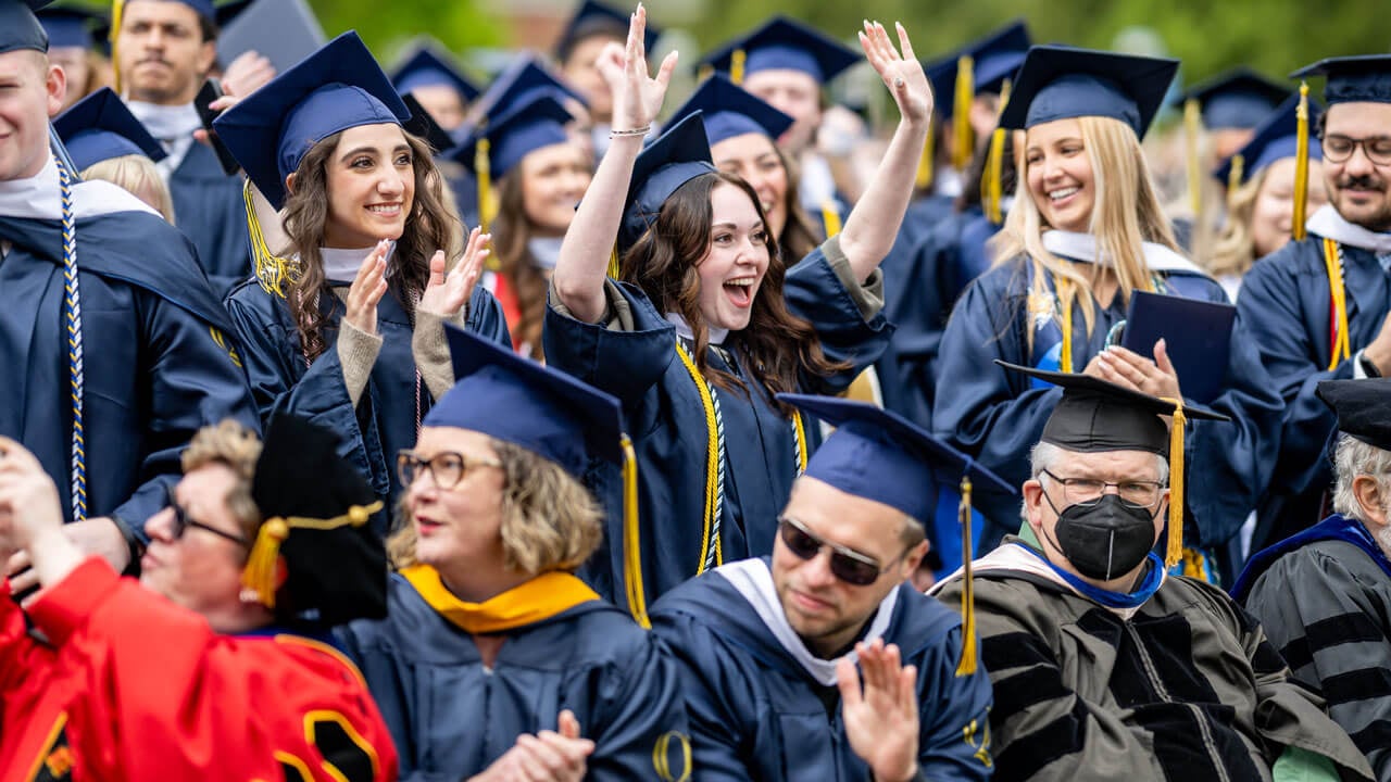 SOC graduates clapping and cheering