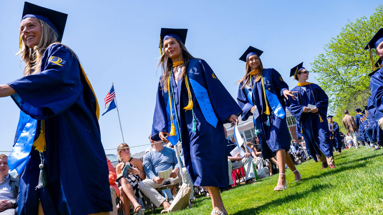 Graduates process into graduation.