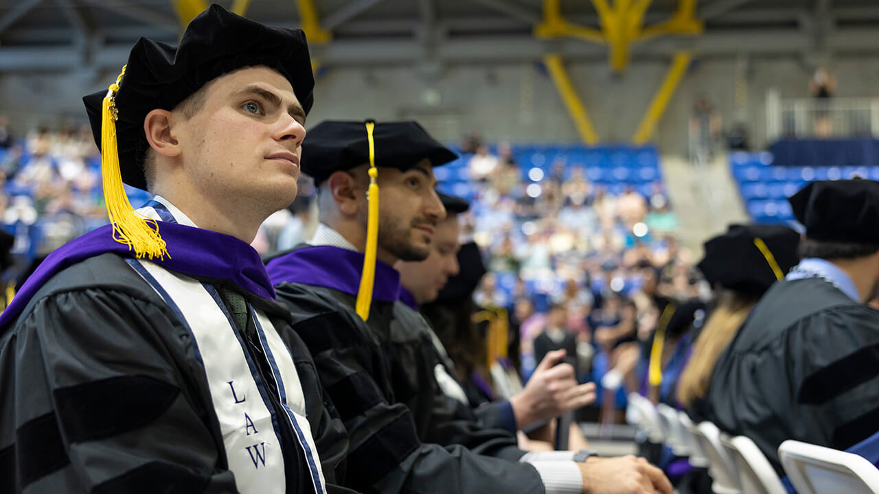 Graduate looks off into the distance