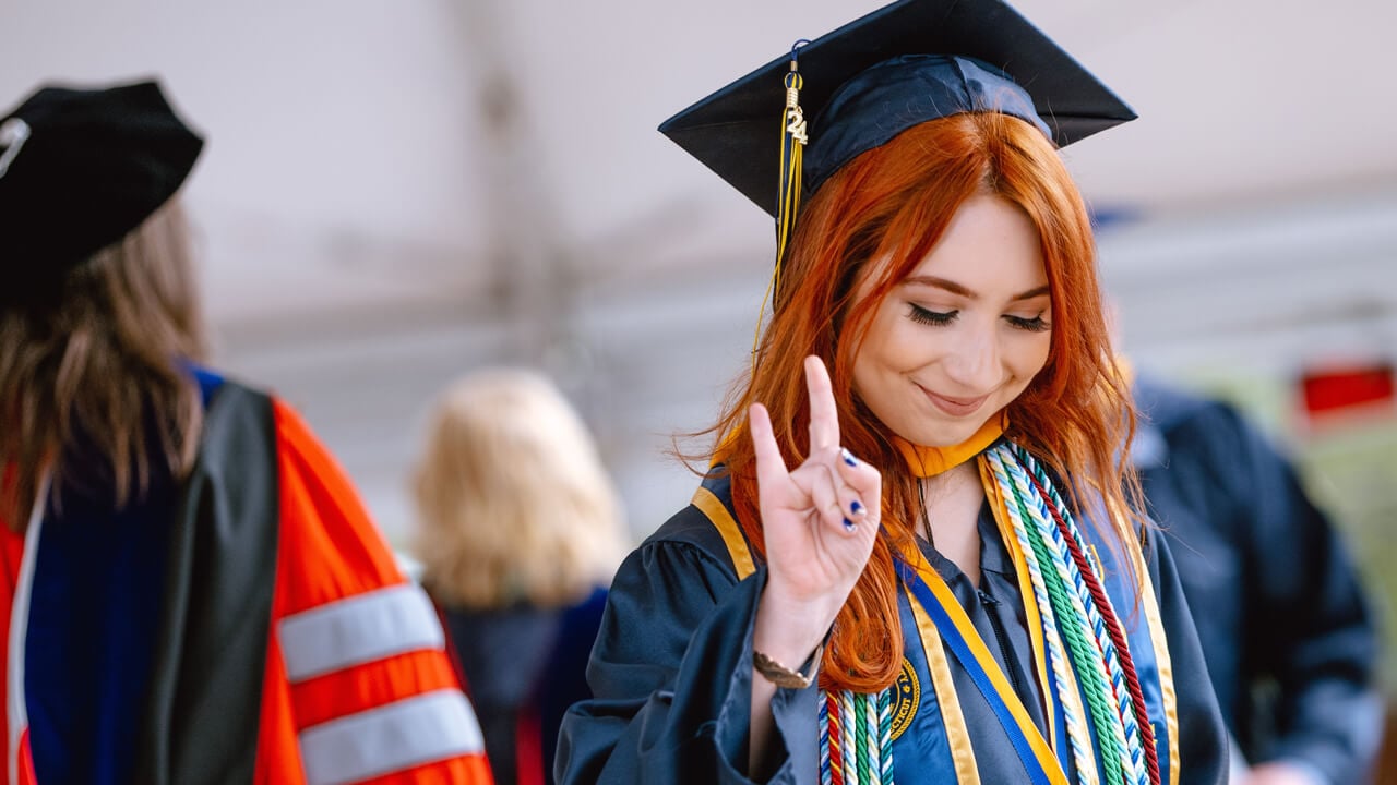 Student holds up hand