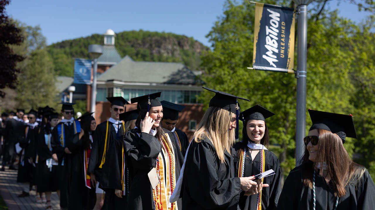 School of Communications graduates line up before processional