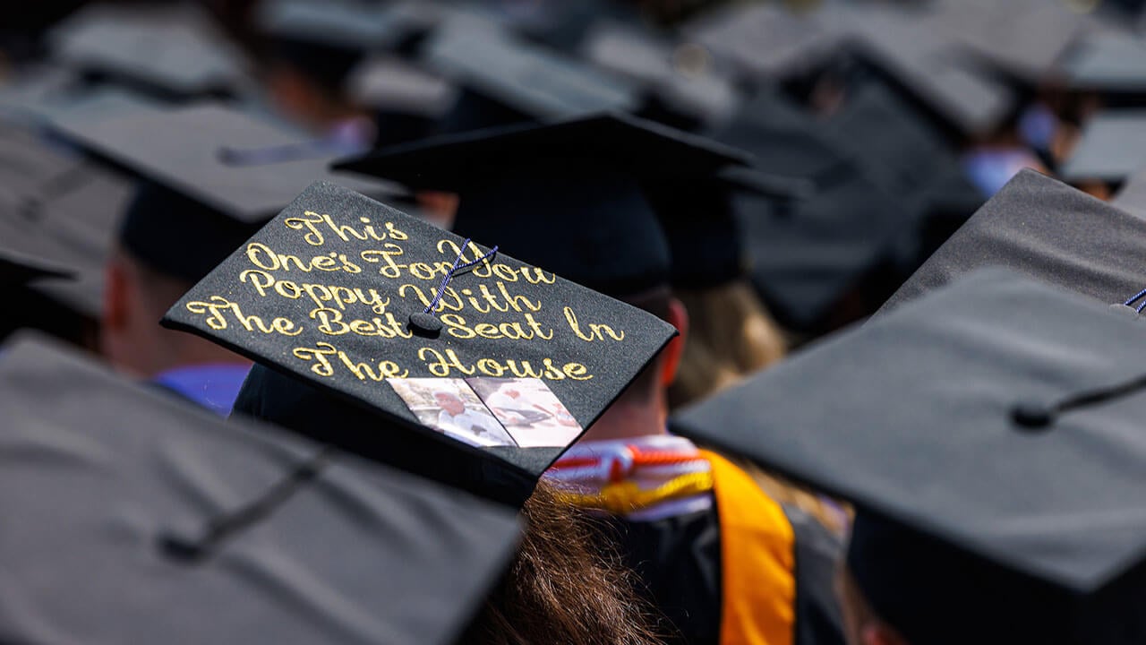 Graduate wears her decorated graduation cap