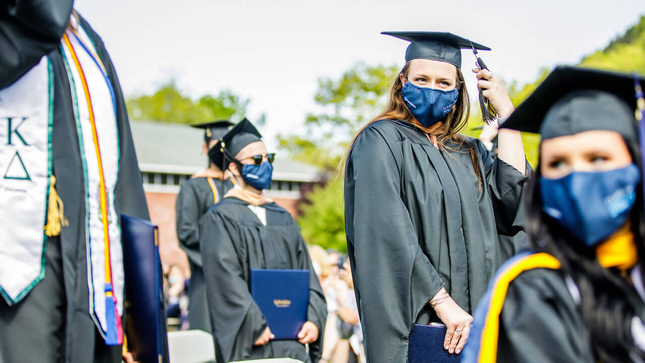 Student moving their tassel