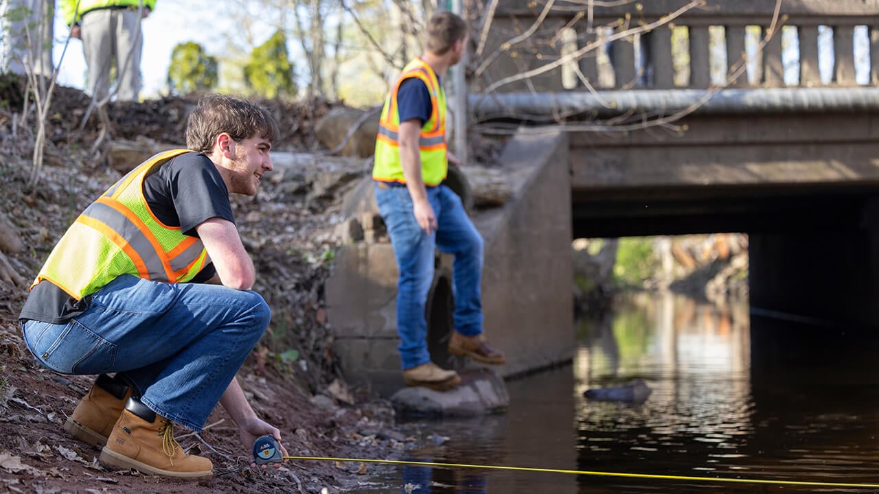 Students work on a bridge.