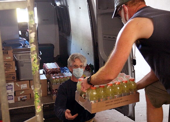 A man picks up donations.