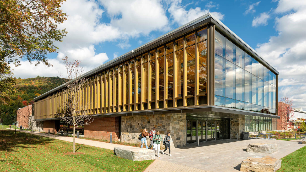 Beautiful sunny day as students walk past the Recreation and Wellness Center