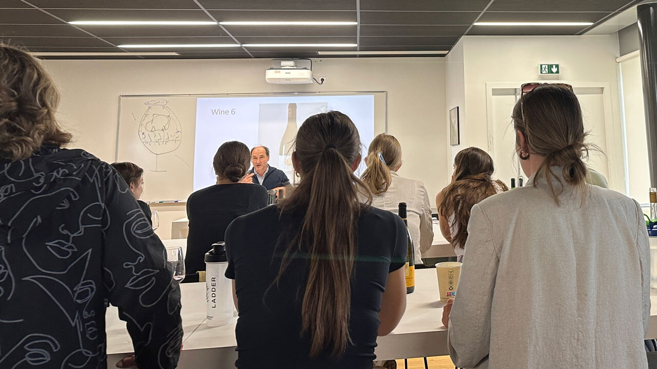 Students sitting in class listening to professor teach