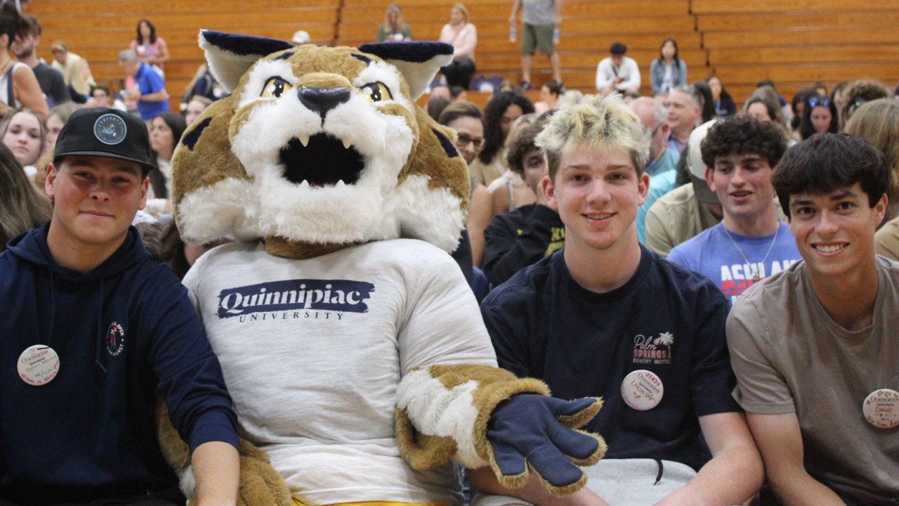 Boomer sits with students