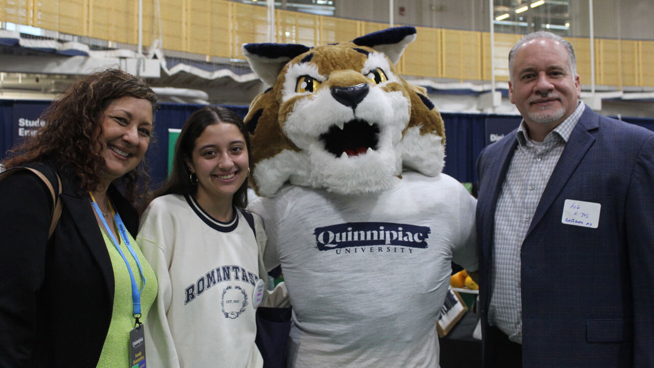 Boomer takes a photo with a family of four