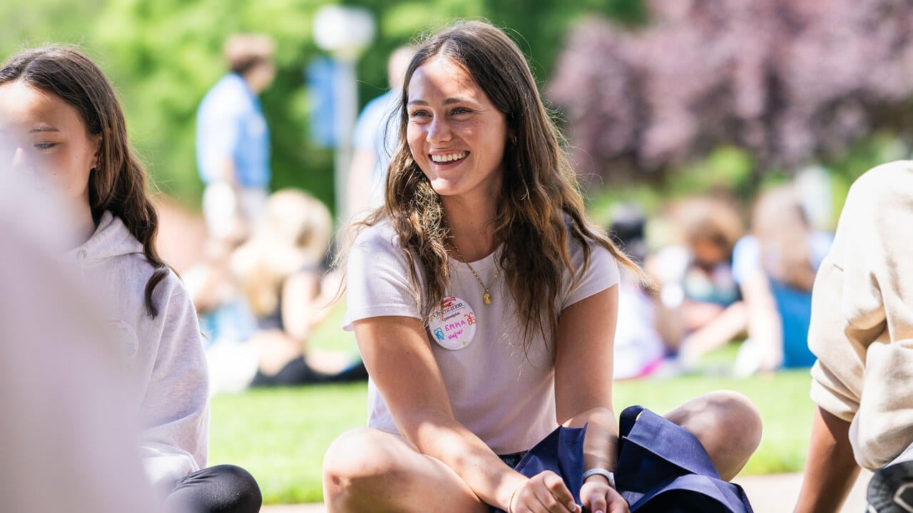 First-year quinnipiac student sitting on the quad