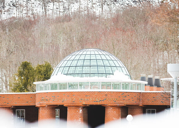 Snow on the business center and the Sleeping Giant State Park mountain