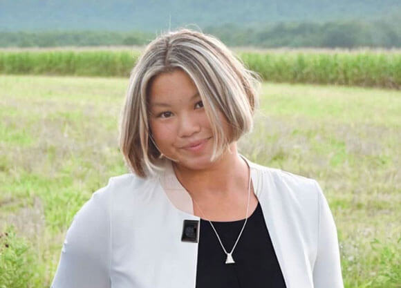 Laine Dubin standing in a field