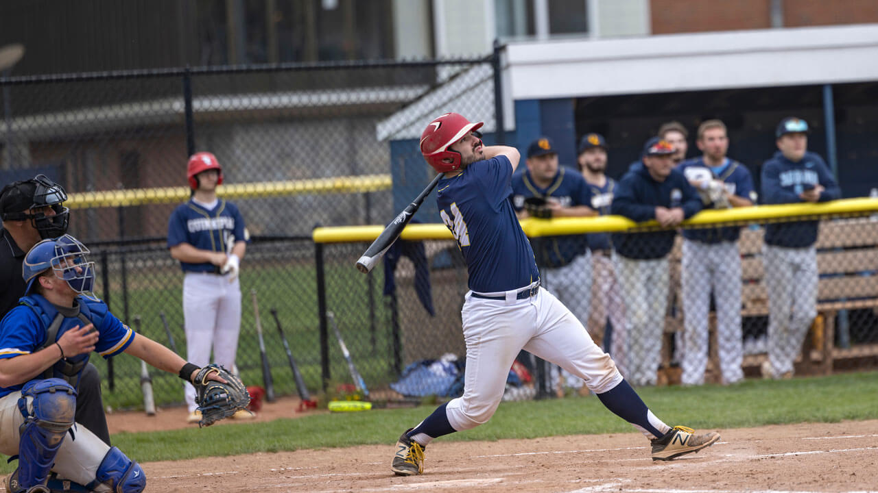 Student swings baseball bat