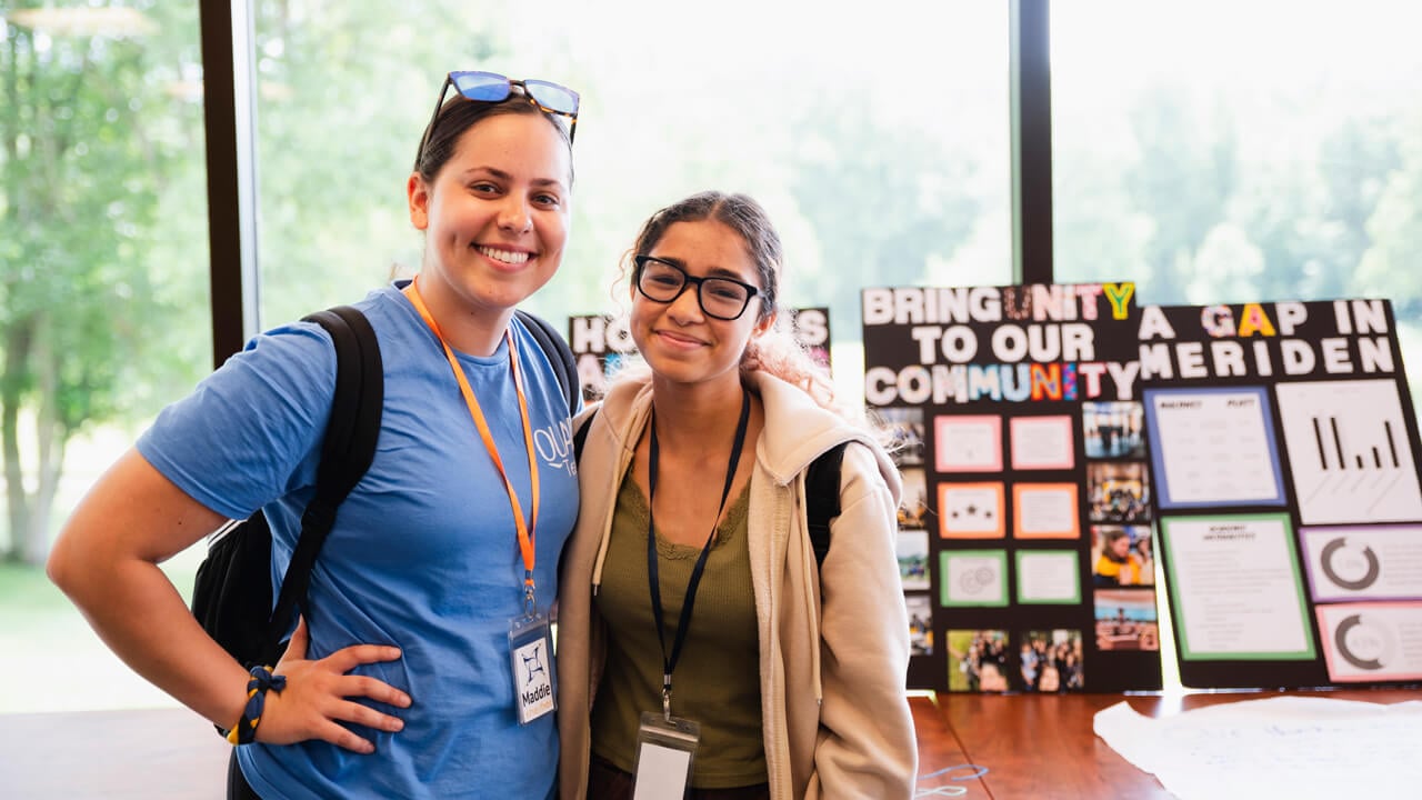 QUADS mentor and QUADS student stand in front of their project at the Quinnipiac North Haven campus.