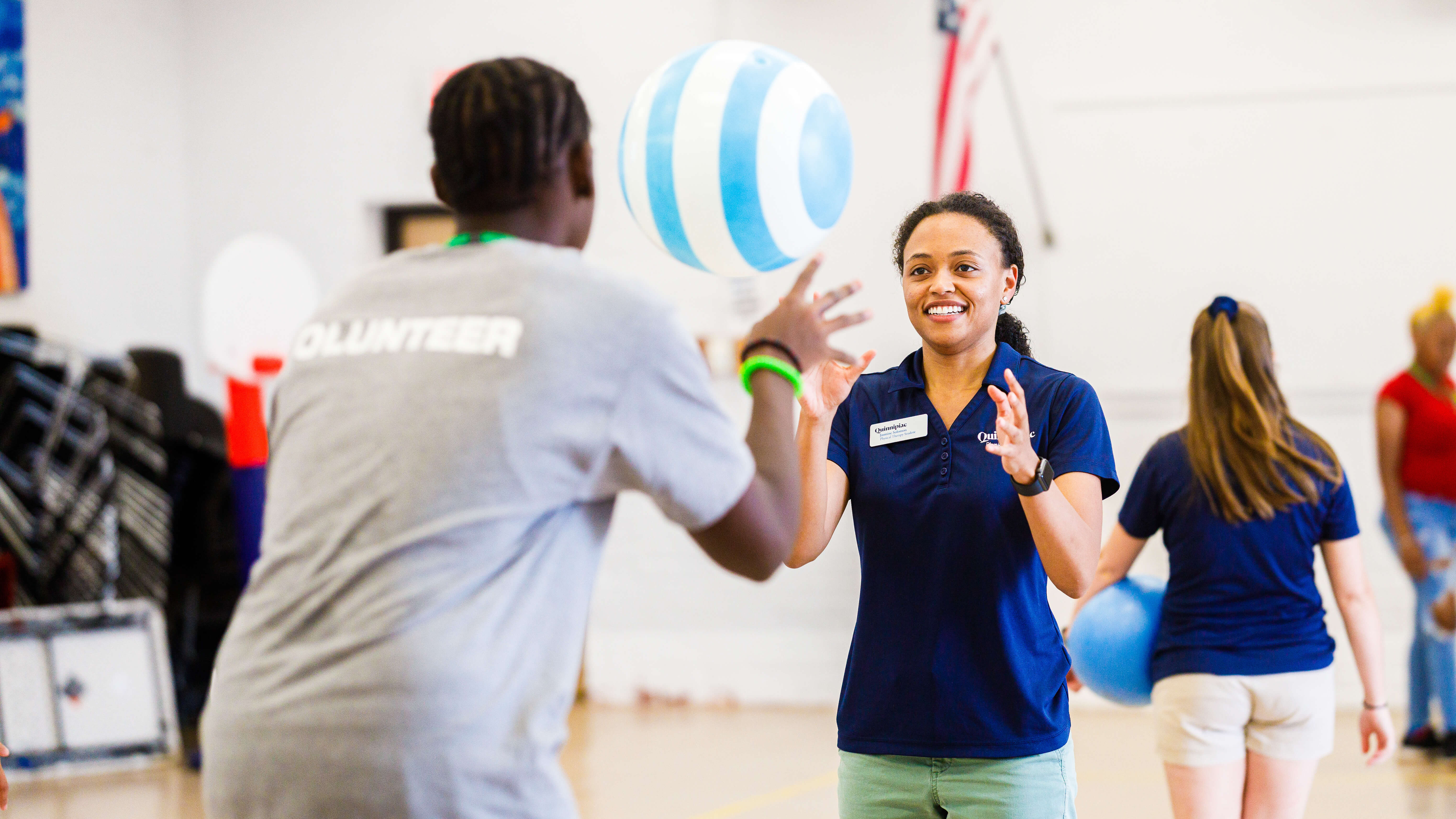 Quinnipiac physical therapy students show local teens some of the exercises they might do with patients someday