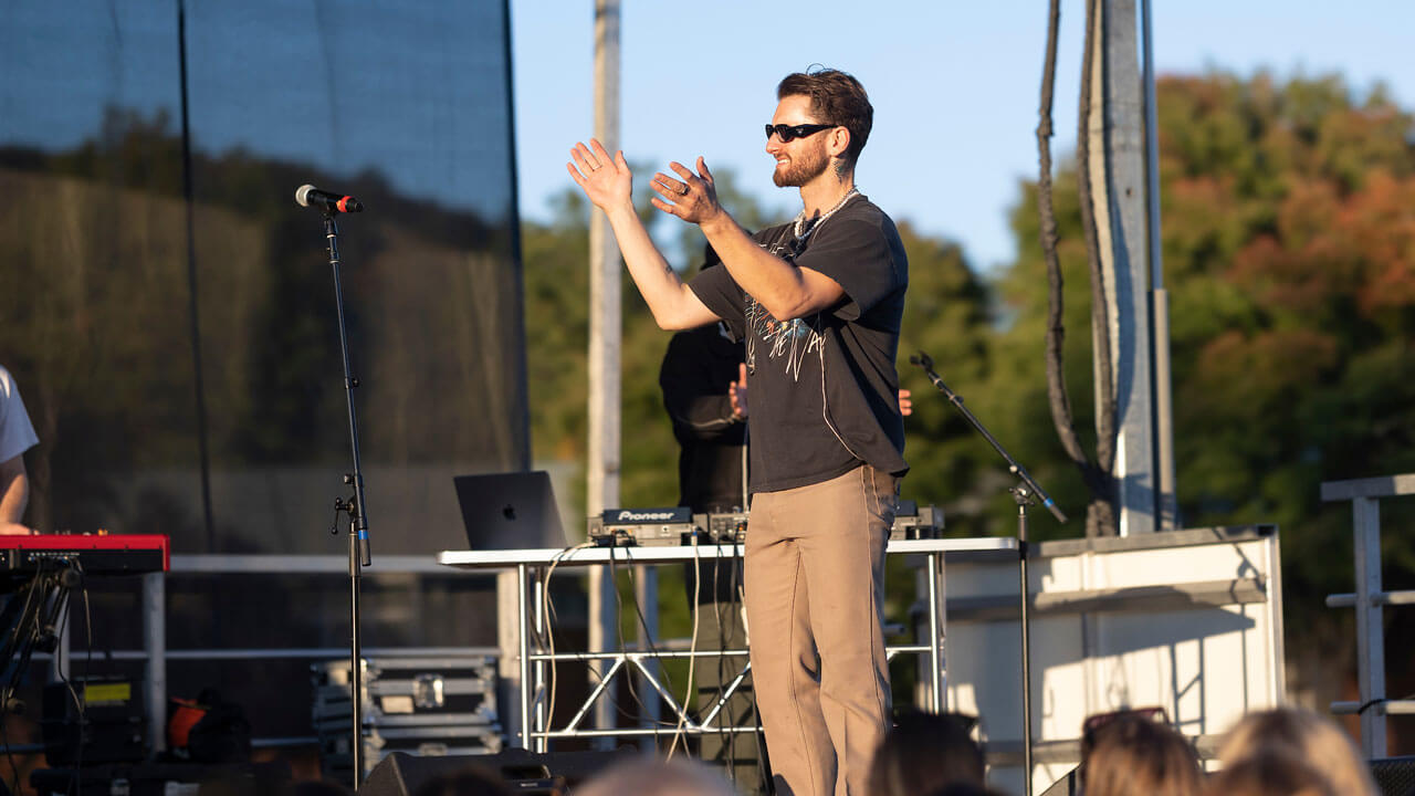 Band standing on stage performing