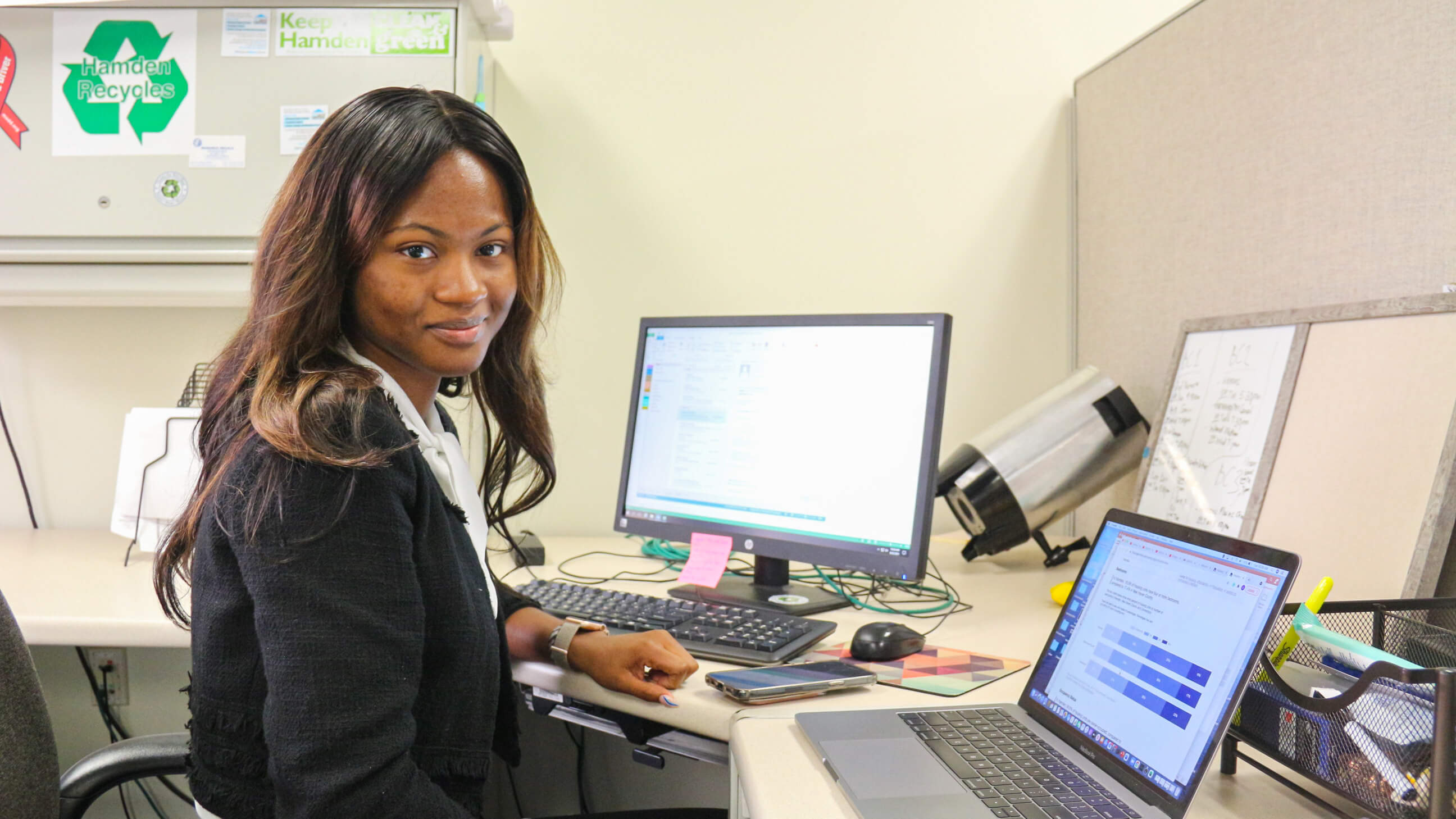 Student sitting at desk working at the mayor's office