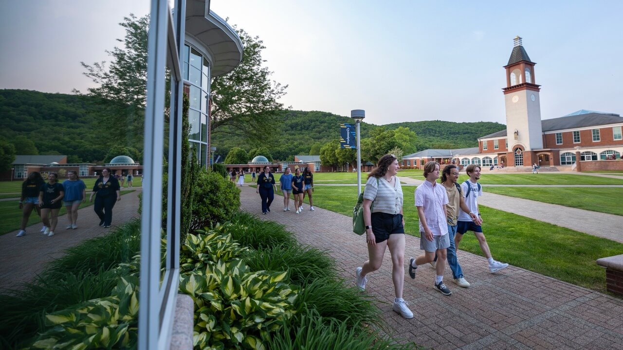 Students walking across the Mount Carmel Quad