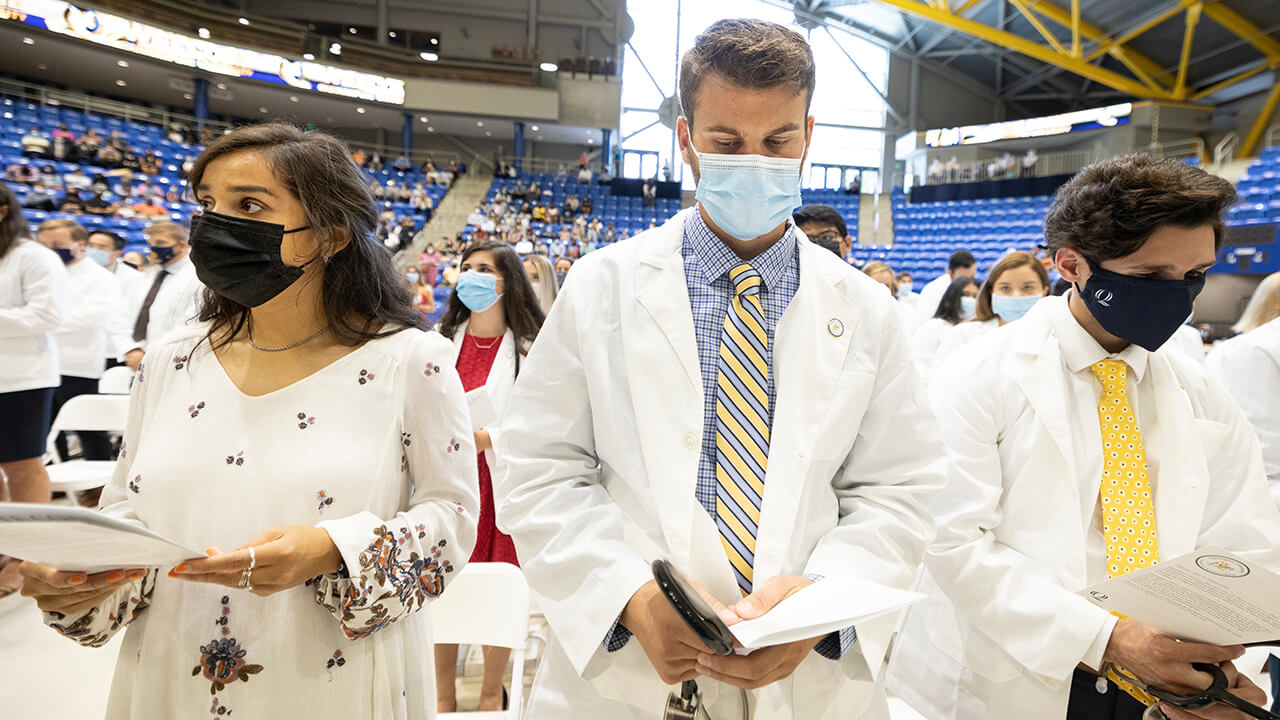 Students read an oath.