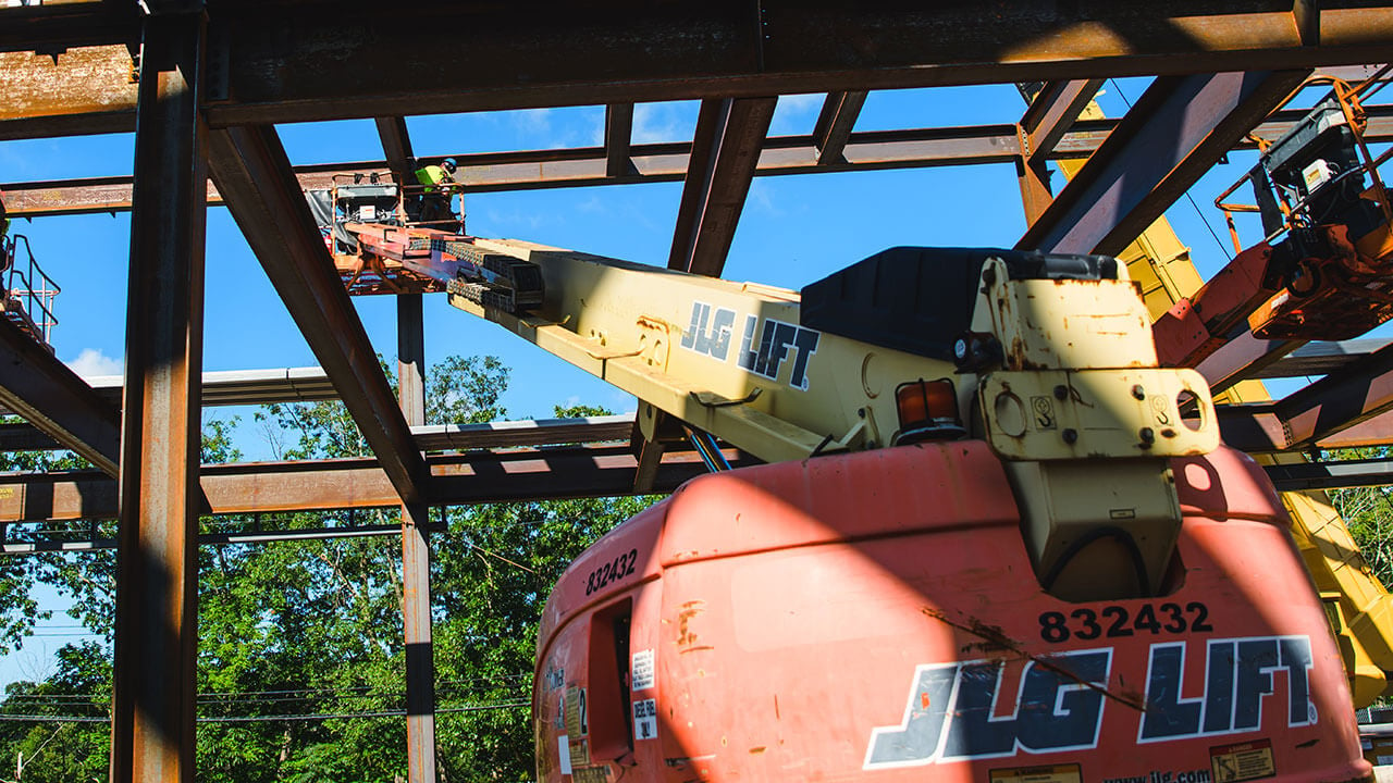 Construction workers build the foundation of a new building