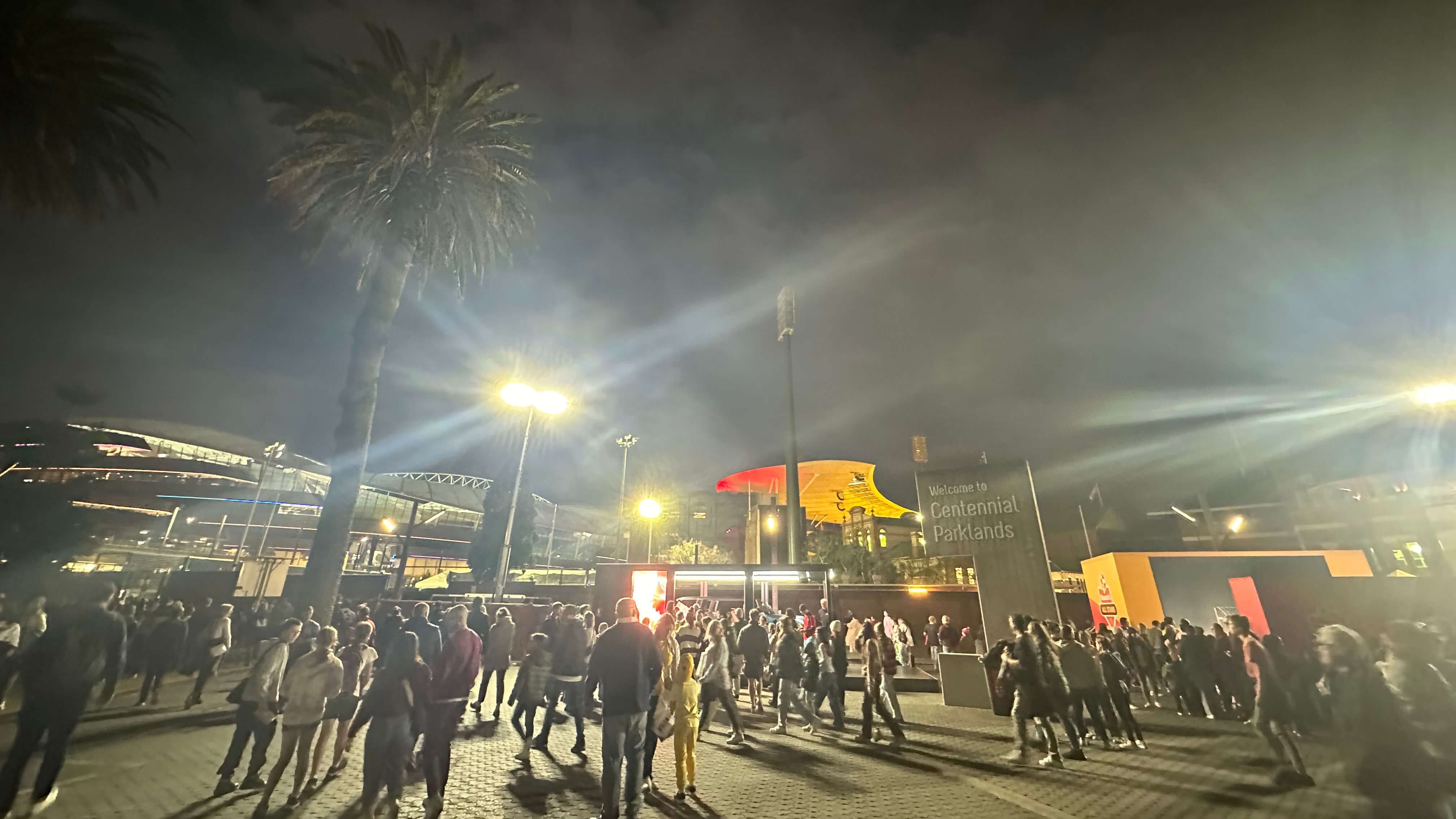 Large groups of people walking around at night