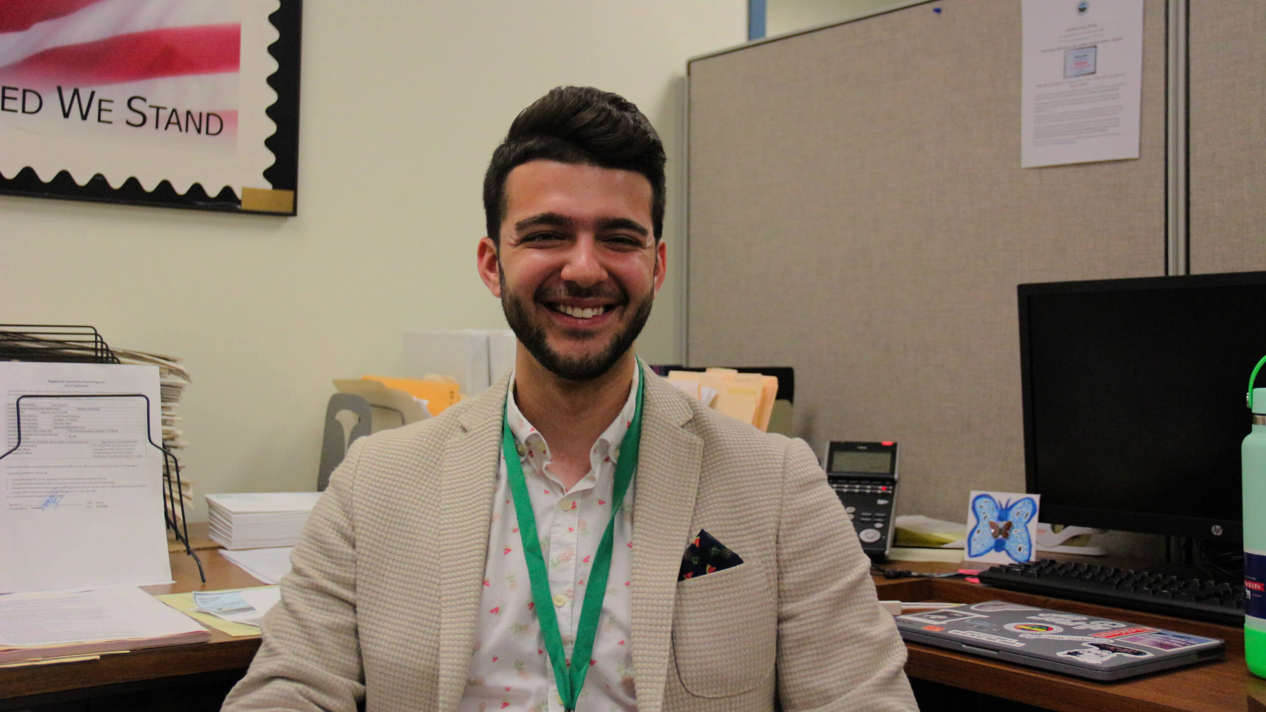 Presidential Public Service Fellow sitting at his desk in the Hamden mayor's office