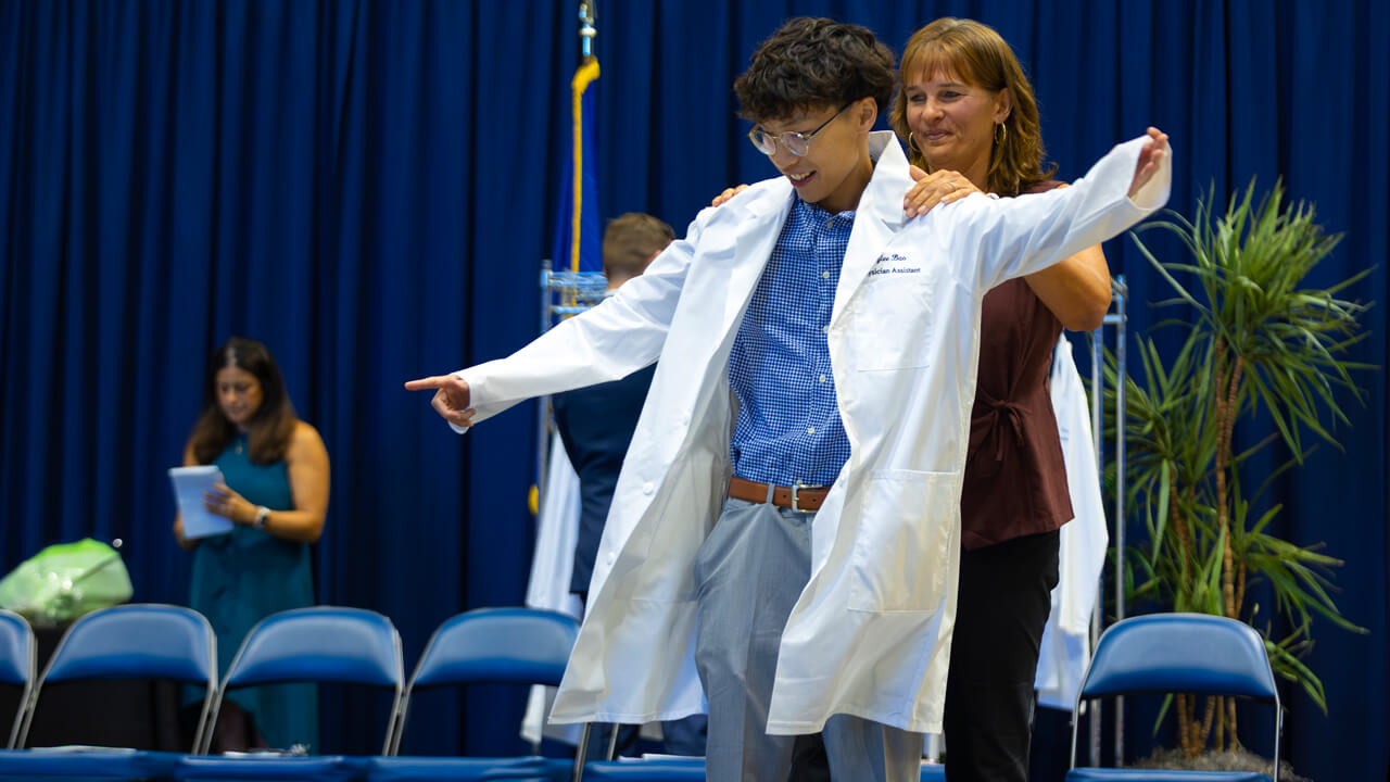 Student receives their white coat