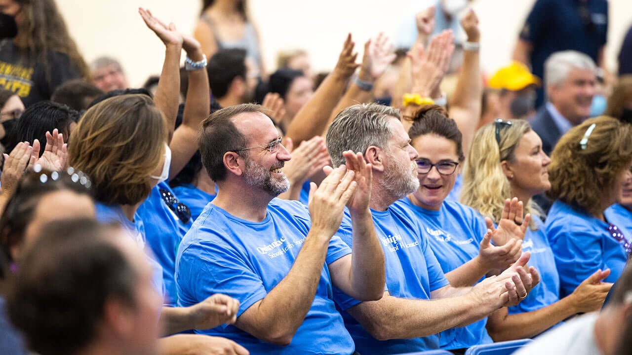 Faculty from the School of Health Sciences clap in celebration of the new year