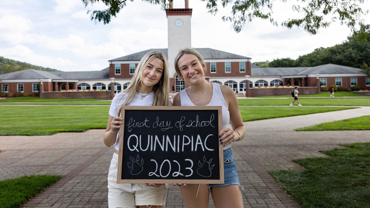 Two students take a photo together on their first day of classes