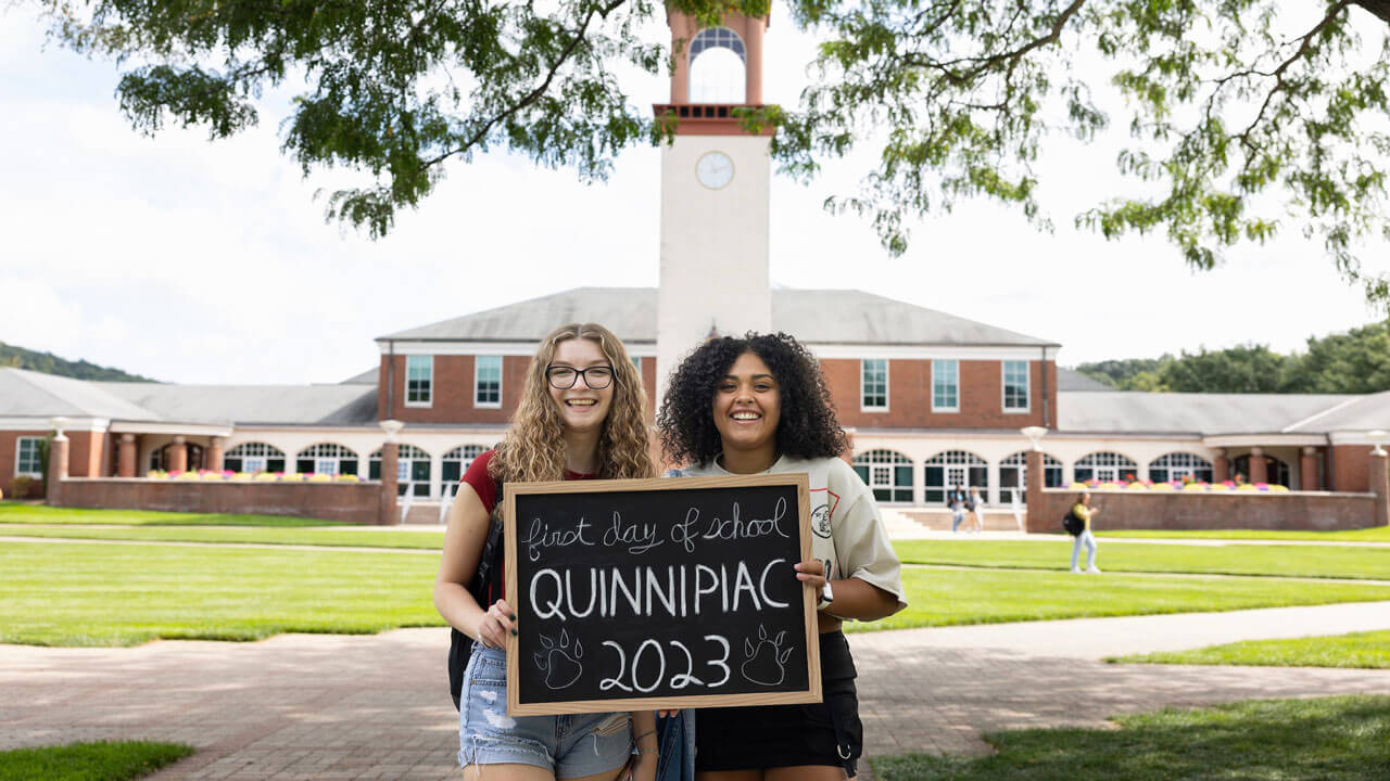 Students smile for a picture on the first day of classes