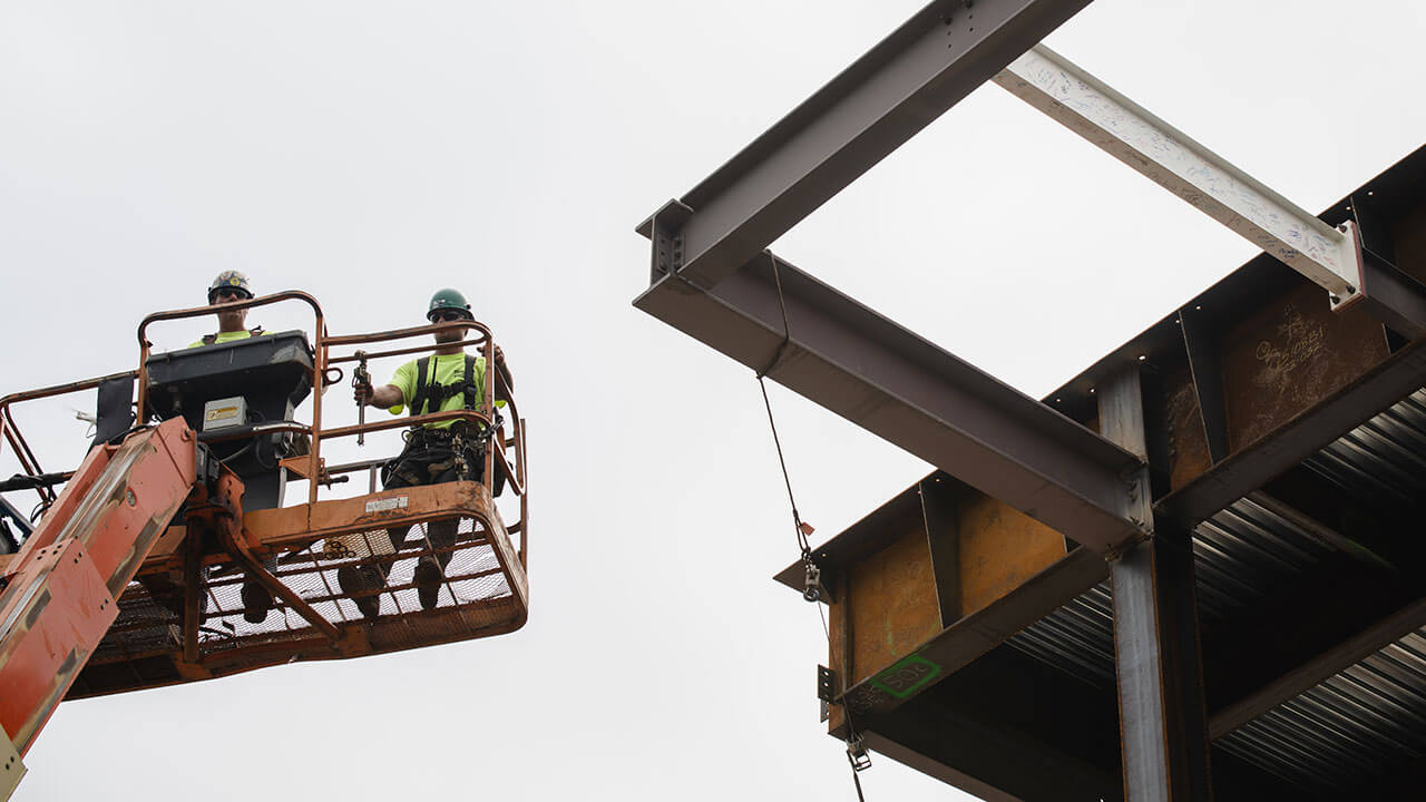 Workers on the construction lift