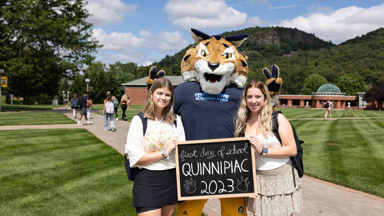 Students taking a photo with boomer